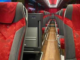 transport, tourism, road trip and equipment concept - travel bus interior and seats photo