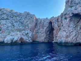 Large natural beautiful cave in the rock and the sea is blue warm in a tourist tropical country photo
