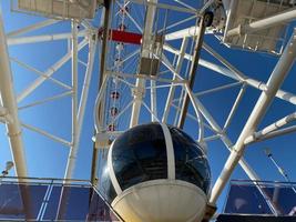 Ferris Wheel Over Blue Sky . Big wheel photo