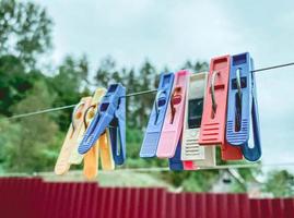 Very nice clothesline for hanging signs or clothes. Hipster clothesline with clothespins for hanging photo