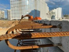 Iron metal rusty reinforcement in concrete and industrial reinforced concrete slabs used in the construction of buildings and structures photo