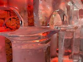 Large transparent winter ice sculptures and figures, columns at the festival. photo