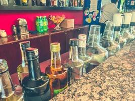 Bottles of spirits and liquor at the bar. photo