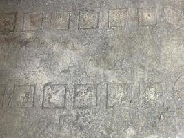 Abstract background. Gray concrete floor with white stone chips. Smooth polished surface photo