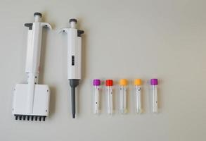 pipette dispenser for laboratory diagnostics. single-channel pipette dispenser with sensitive tip and display. the dispenser has a scale for determining the volume photo