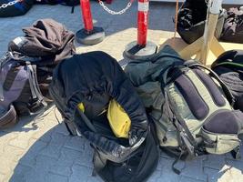 Parachute backpacks for extreme skydiving lie on the ground photo