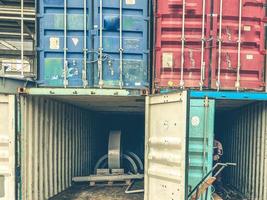 warehouse for building materials. multi-colored containers for materials, mini-warehouses made of plastic. inside container metal building material photo