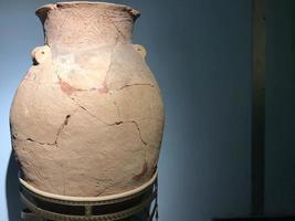 Antique cracked clay pot. Handmade medieval pots photo