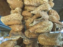 mushrooms are dried and hanging on the counter. vegetables, vegan food, healthy food. green tail pepper dried mushrooms for soups and snacks photo