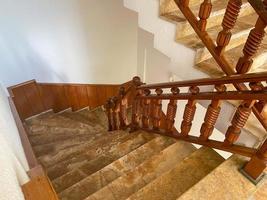 Modern brown oak wooden stairs. Modern house interior photo