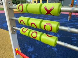 Children's developmental sports toy on the playground in the open-air courtyard photo