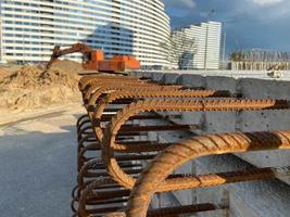 Iron metal rusty reinforcement in concrete and industrial reinforced concrete slabs used in the construction of buildings and structures photo