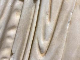 Complete setting of the textures of the face of a smooth rock with stratum outdoors photo