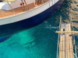 Sailboat side view with fenders of different sizes and colors photo