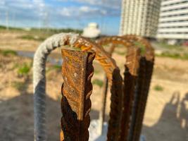 Iron metal rusty reinforcement in concrete and industrial reinforced concrete slabs used in the construction of buildings and structures photo