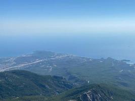 Beautiful view of the sea and mountains. A birds-eye view of the rocky coast. Top view photo