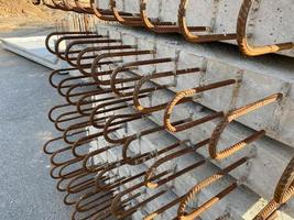 Iron metal rusty reinforcement in concrete and industrial reinforced concrete slabs used in the construction of buildings and structures photo
