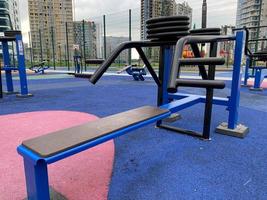 Close up outdoors gym equipment at the park sports ground. Different machines for training, activity at workout space photo