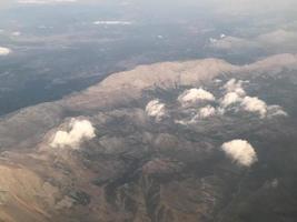 Mountain peak over the clouds photo