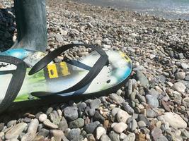 Sleepers on a pebble beach in a summer outing. copy space photo