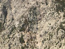 The view from the height on jungle and mountains covered with tropical greenery and trees photo