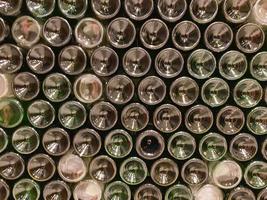 Bottoms of wine bottles. Creative green and textured abstract background photo