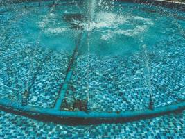 swimming pool with clean, clear water. chlorinated blue water in a bathing bowl. healthy lifestyle, active water sports in the pool photo