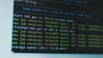 Cryptocurrency mining on a computer screen. The algorithm of the computer program on the monitor. Execution of the program code for the mining program. Pop-up lines of a computer program. video