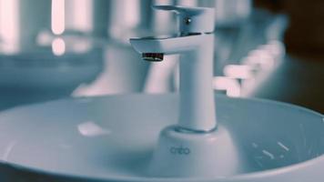 Rotating washbasin. Studio filming. In the background a row of toilets. 4k video