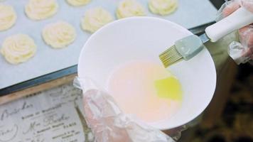 The chef grinds the mashed potatoes. Mix the puree with the egg yolks. Macro shooting video