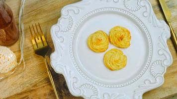 The chef makes potato cookies using a food bag. Potato cookies canonic recipe Brie, parmesan and Heavy cream. Macro shooting video