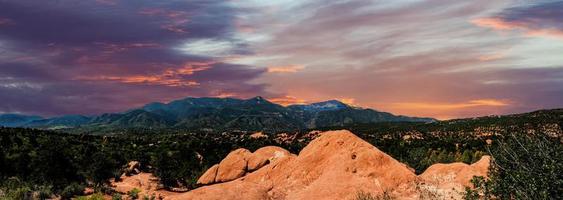 Panoramic landscape view from the Garden of the Gods park looking towards the west and Pikes Peak at the spectacular sunset. photo