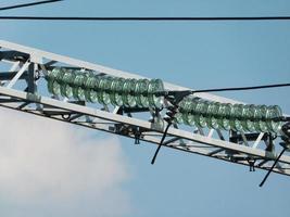 Glass linear isolators on high-voltage wires.