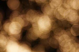 Blurred circles yellow color on a black background. Abstract background. photo