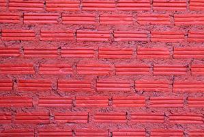 Red wall from bricks for background. photo