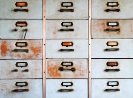 Old metal cabinet with drawers blue color with rusty. photo