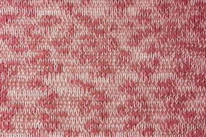 Bright red white melange knitwear wool fabric texture background. Abstract textile backdrop photo