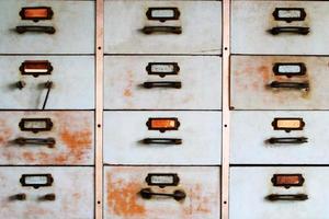 Old metal cabinet with drawers blue color with rusty. photo