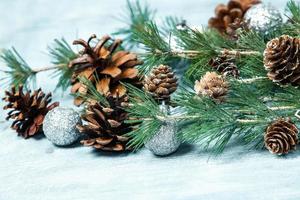 New Year or New Year's Eve background with fir branch with cones. The year 2023 is coming. photo