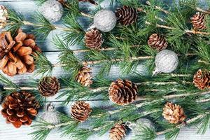 New Year or New Year's Eve background with fir branch with cones. The year 2023 is coming. photo