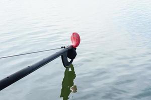 Boat engine propeller on water surface photo