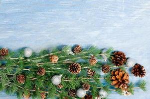 New Year or New Year's Eve background with fir branch with cones. The year 2023 is coming. photo