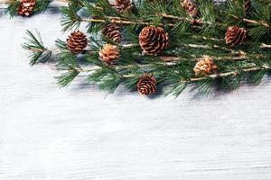 New Year or New Year's Eve background with fir branch with cones. The year 2023 is coming. photo