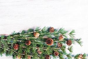 New Year or New Year's Eve background with fir branch with cones. The year 2023 is coming. photo