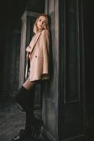 Portrait of young attractive pretty blonde woman in the beige jacket photo