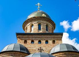 Christian church cross in high steeple tower for prayer photo