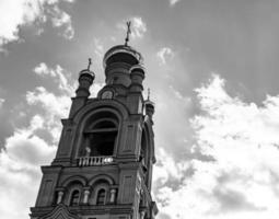 Christian church cross in high steeple tower for prayer photo