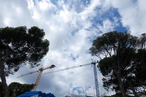 Cranes at work on a building construction site photo