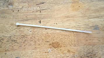 White cable ties on wooden table photo