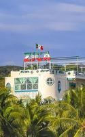 Puerto Escondido Oaxaca Mexico 2022 Hotels resorts buildings in paradise among palm trees Puerto Escondido. photo